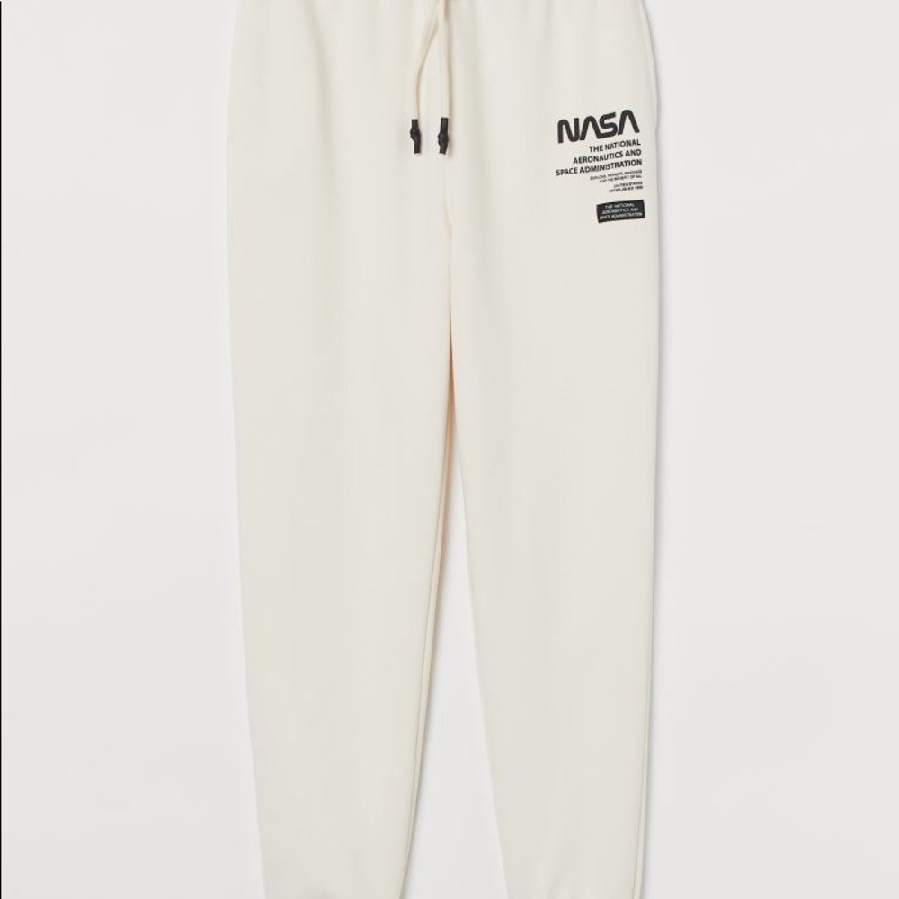 Cream colored NASA sweatpants